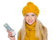 Happy girl in autumn clothes with tv remote control