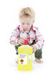 Child playing with toxic cleaner