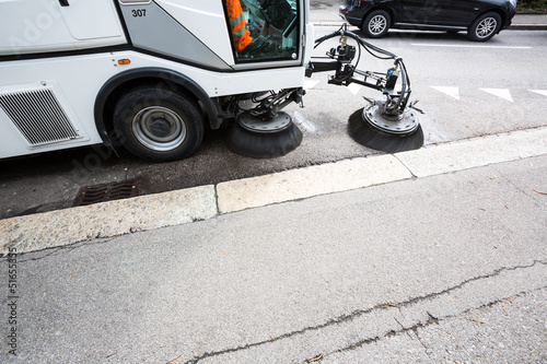 Photo: Detail of a street sweeper machine/car cleaning the road Detail of a street sweeper machine/car cleaning the road