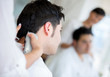 Photo: Man getting a haircut Man getting a haircut