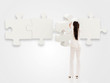 Business woman with a puzzle