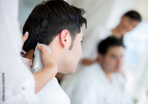 Photo: Man getting a haircut Man getting a haircut