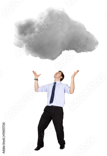 Photo: Business man lifting a cloud Business man lifting a cloud