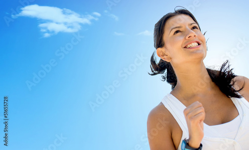 Photo: Woman running a marathon Woman running a marathon