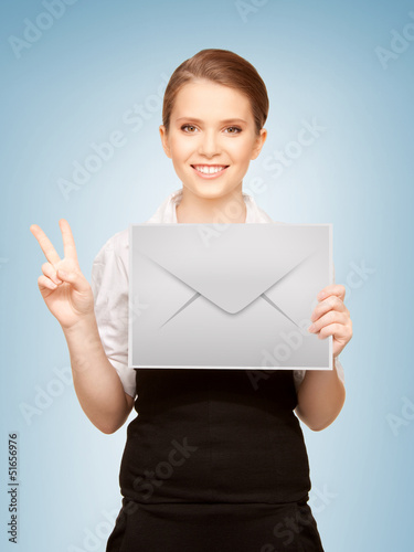 Photo: woman showing virtual envelope woman showing virtual envelope