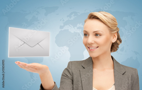 Photo: woman showing virtual envelope woman showing virtual envelope