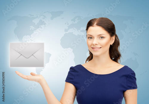 Photo: woman showing virtual envelope woman showing virtual envelope