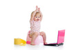 baby girl sitting on chamberpot with notebook