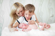 mother with her eldest son looking at sleeping baby