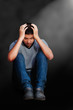 Foto: Sad asian teenager boy sitting on the floor Sad asian teenager boy sitting on the floor