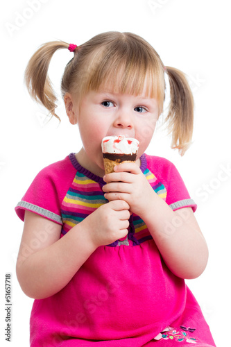 Photo: child girl eating ice cream in studio isolated child girl eating ice cream in studio isolated