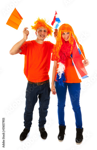 Photo: Young couple for kings day in Holland Young couple for kings day in Holland