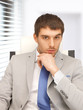 young businessman sitting in chair