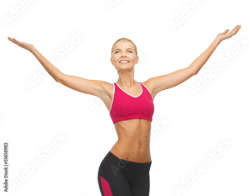 Photo: sportswoman with raised up hands sportswoman with raised up hands
