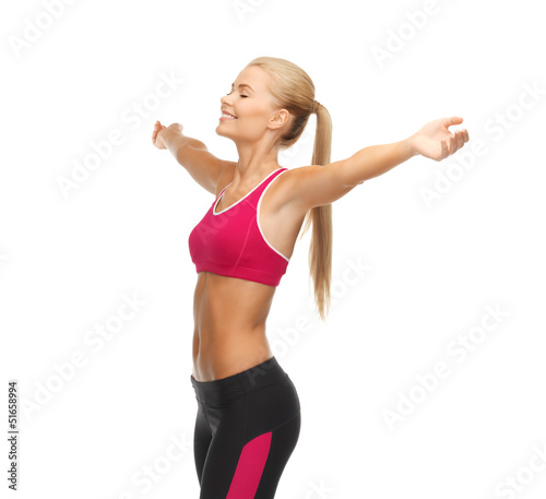 Photo: sportswoman with raised up hands sportswoman with raised up hands