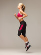 sporty woman running or jumping