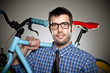 Portrait of a normal boy with glasses over grey background.