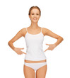 woman in blank shirt pointing at her belly