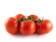 Fresh red tomatoes on branch. Isolated on white.