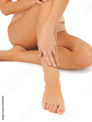 Photo: female legs and hand female legs and hand