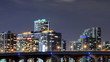 Time lapse of urban scene at night with buildings and traffic