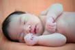 Newborn Asian baby girl sleeping