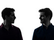 two  men twin brother friends looking at each others silhouette