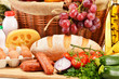 Assorted grocery products including vegetables fruits wine bread