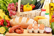 Assorted grocery products including vegetables fruits wine bread