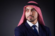 Arab businessman in dark studio