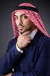 Arab businessman in dark studio