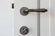 door with handle and key in the lock