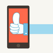 Big thumb up in smartphone.