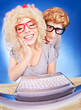Photo: Funny guy is spying on girlfriend she is using laptop computer Funny guy is spying on girlfriend she is using laptop computer