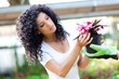Female florist checking flowers