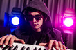 DJ mixing music at disco
