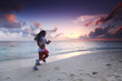 Two women running on beach