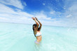 Woman splashing in sea