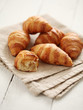 Photo: Fresh french croissants on a tablecloth Fresh french croissants on a tablecloth