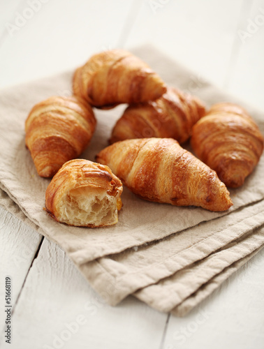 Photo: Fresh french croissants on a tablecloth Fresh french croissants on a tablecloth