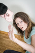 Man with knife coming to his wife. Home violence concept
