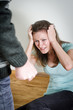 Man with knife coming to his wife. Home violence concept