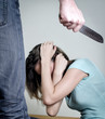 Man with knife coming to his wife. Home violence concept