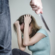 Man with knife coming to his wife. Home violence concept