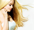 Beauty Portrait. Beautiful young Woman Touching her Face