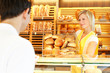 Shopkeeper with basket of bread