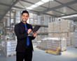 Photo: Young businessman with a clipboard Young businessman with a clipboard