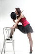 showgirl woman dance in red corset chair white isolated