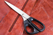 tailor shears and pattern on brown leather