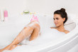 beautiful young woman takes bubble bath